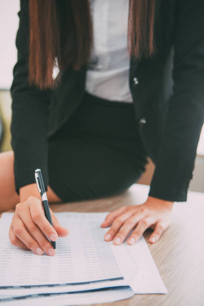 istock Cropped View of Business Woman Checking Document 657747334