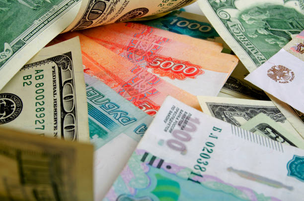 istock Many US dollars and Russian rubles - currency exchange. 657747580