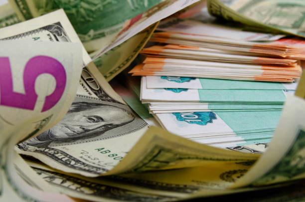 istock Many US dollars and Russian rubles - currency exchange. 657747686