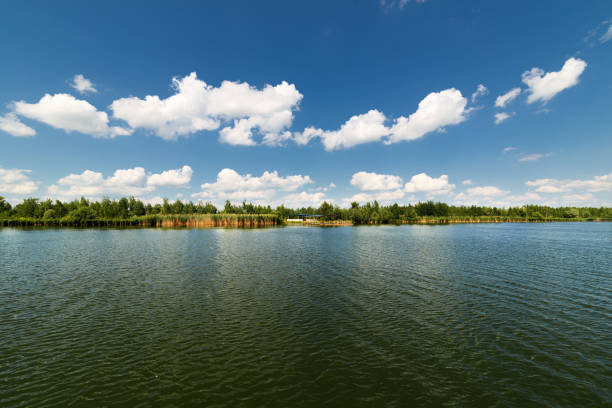 istock Clean lake and beautiful blue sky with clouds 657747768