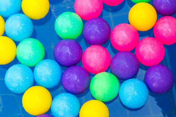 istock Colorful plastic balls in pool , pool villa house 657750604