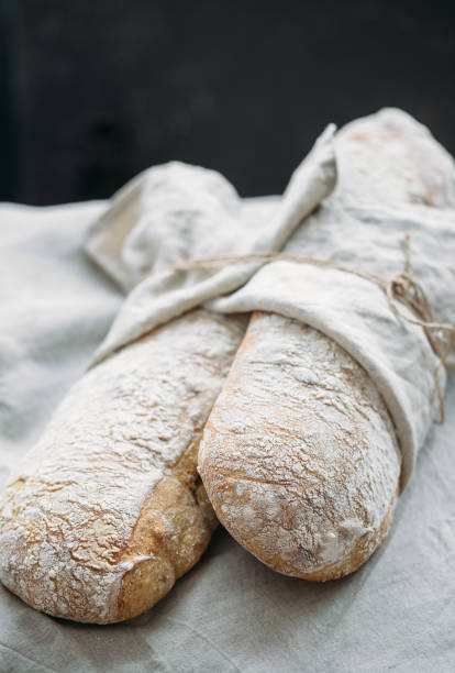istock Fresh Italian bread on black background 657751302