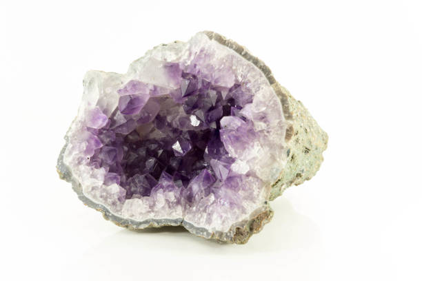 Beautiful semiprecious stone amethyst druse  on a white background An attractive amazing mineral on white paper, from a personal collection of semi-precious stones and minerals Gemmary stock pictures, royalty-free photos & images