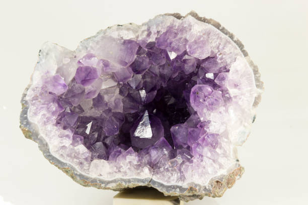 Beautiful semiprecious stone amethyst druse  on a white background An attractive amazing mineral on white paper, from a personal collection of semi-precious stones and minerals Gemmary stock pictures, royalty-free photos & images