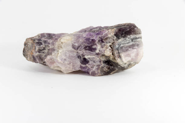 Beautiful semiprecious stone amethyst druse  on a white background An attractive amazing mineral on white paper, from a personal collection of semi-precious stones and minerals Gemmary stock pictures, royalty-free photos & images