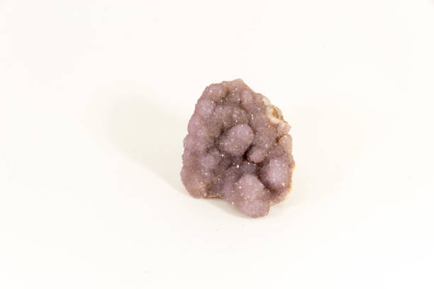 Beautiful semiprecious stone amethyst druse  on a white background An attractive amazing mineral on white paper, from a personal collection of semi-precious stones and minerals Gemmary stock pictures, royalty-free photos & images