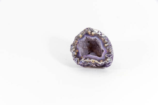 Beautiful semiprecious stone amethyst druse  on a white background An attractive amazing mineral on white paper, from a personal collection of semi-precious stones and minerals Gemmary stock pictures, royalty-free photos & images