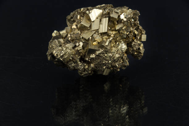 istock Beautiful semi-precious stone Pyrite on a black background 657751776