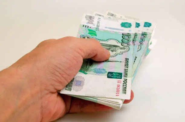 A lot of money Russian rubles in a hand.