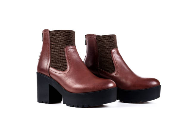 istock ladies brown boots on a white background 657757036
