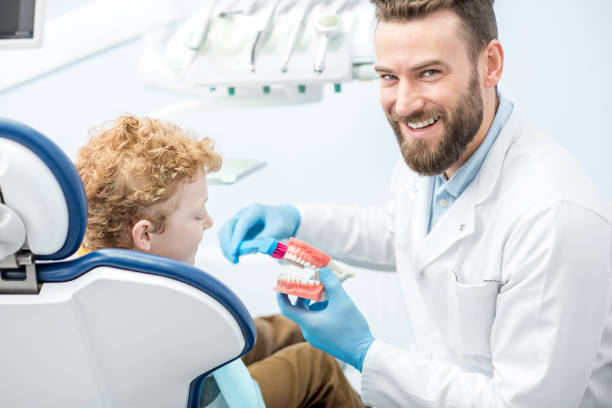 istock Dentist with boy at the dental office 657764448