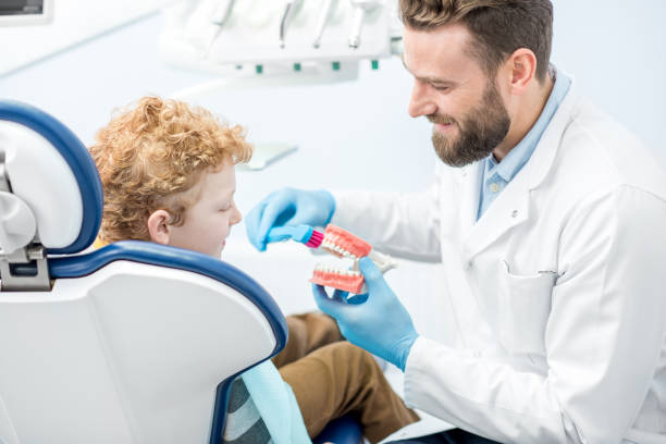 istock Dentist with boy at the dental office 657764464