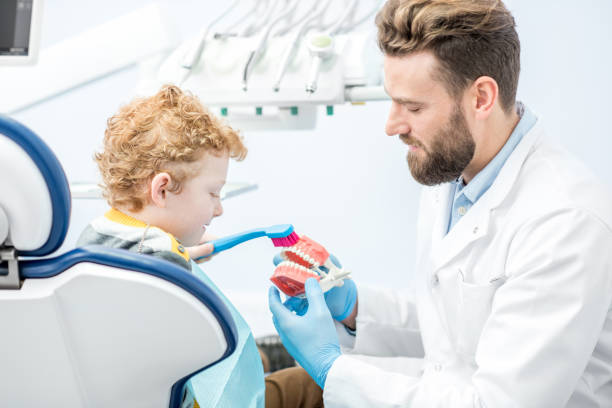 istock Dentist with boy at the dental office 657764470