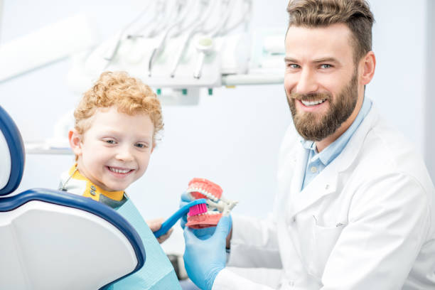 istock Dentist with boy at the dental office 657764486