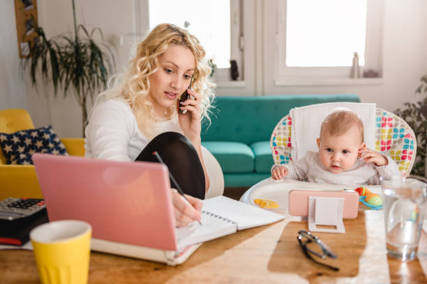 istock Mother talking on smart phone at home office 657765132