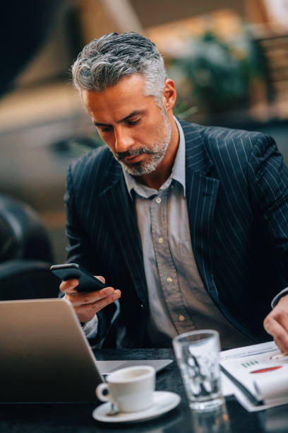 istock Businessman texting at an internet cafe 657767596