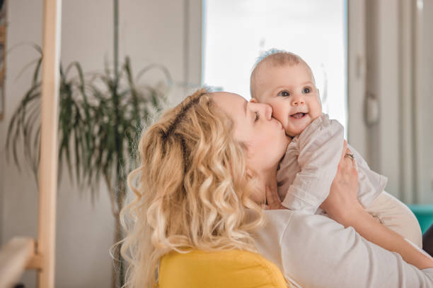 istock Mother kissing her baby 657768208