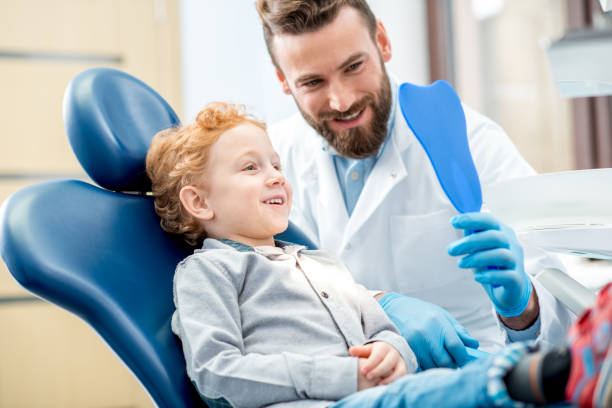 istock Boy with dentist at the dental office 657768438