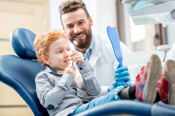Boy with dentist at the dental office