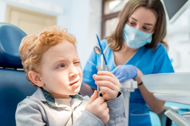 istock Boy with dentist at the dental office 657769024