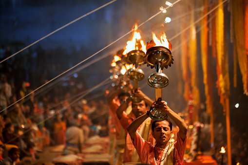 Varanasi, India - December 13, 2015 : Hindu priests perform an Arti worship ceremony at  Ganges River, Varanasi, Uttar Pradesh, India