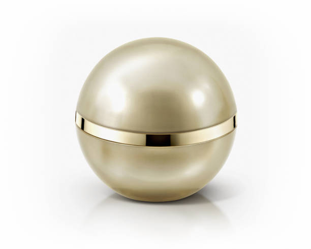 istock Golden sphere cosmetic jar on white background 657775818