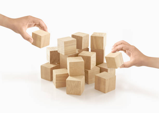 Two hands playing wooden box on isolated background.