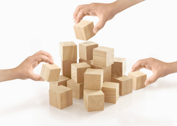 istock Many hands playing wooden box on isolated background. 657779428