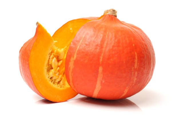 istock Fresh orange pumpkin with seeds isolated on white background 657779518