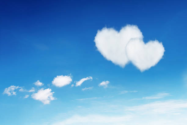 istock couple white heart shaped clouds on blue sky 657779860