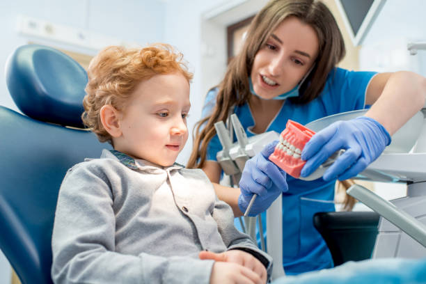 istock Dentist with boy at the dental office 657780714