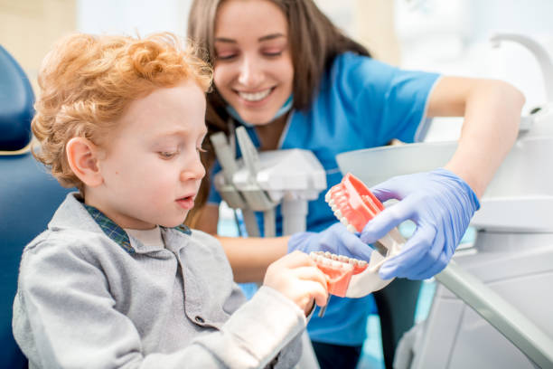 istock Dentist with boy at the dental office 657780786