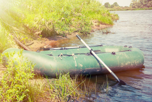 istock Inflatable boat on the a river near shore 657784458
