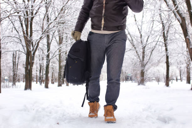 istock bearded man walking in a winter park 657790868