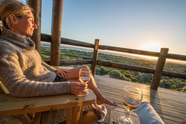 istock Young couple relaxing on terrace at sunset 657791658