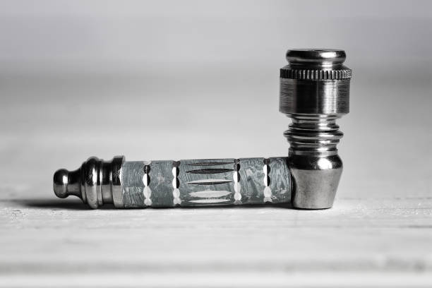 istock marijuana pipe on wooden background 657799290
