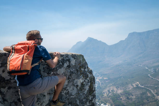 istock Young man in Cape Town rock climbing 657804672