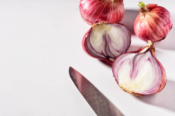 istock Several bulbs of red onions on the table 657812544