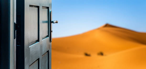 istock Opened door concept to beautiful and imaginary desert landscape 657813054