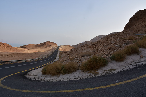 Winding desert road to the Dead Sea