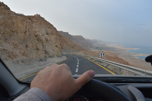 Winding desert road to the Dead Sea