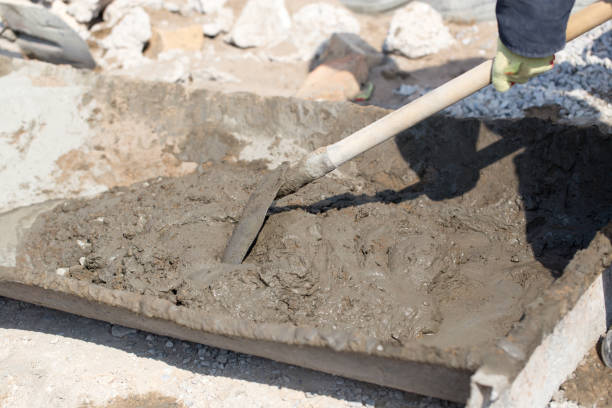 istock Worker kneads concrete at the construction site 657819754