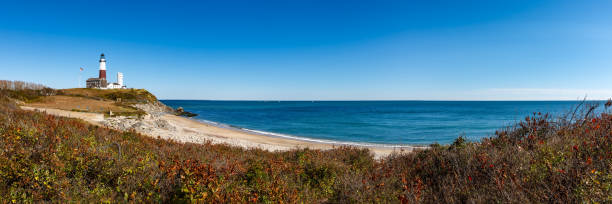 Montauk Point State Park Lighthouse, Long Island, NY Panoramic view on Montauk Point State Park Lighthouse and the Atlantic Ocean. Long Island, New York State montauk point stock pictures, royalty-free photos & images