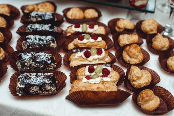 istock eclairs, traditional french dessert. white table 657820134