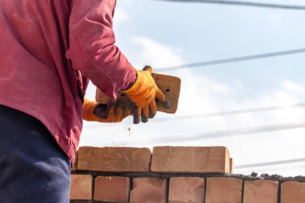 istock Worker builds a brick wall in the house 657823204