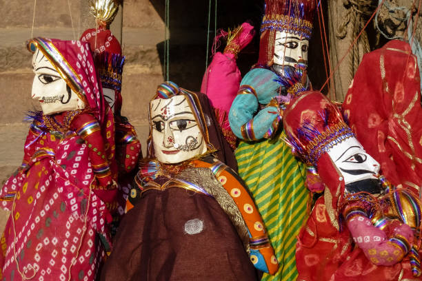istock India art style puppets hanging for display 657826226