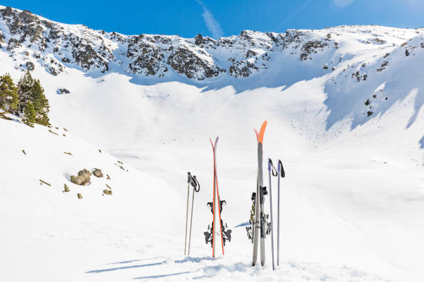 istock Pair of skis and ski poles on snow 657833254