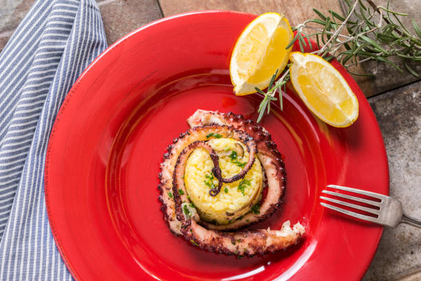 istock Grilled Seafood Octopus on Saffron Risotto with Brown Shimeji Mushrooms 657836264