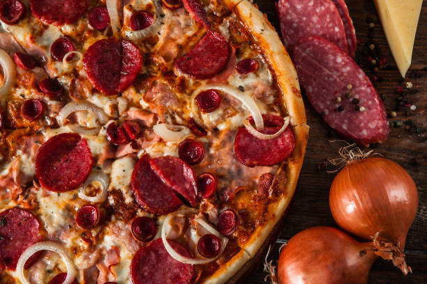 istock Pizza with sausage assortment and onion, close up 657836994