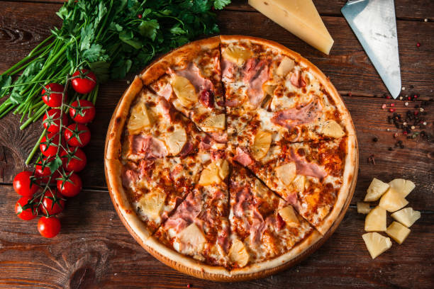 istock Hawaiian pizza on rustic wood table, flat lay 657837118